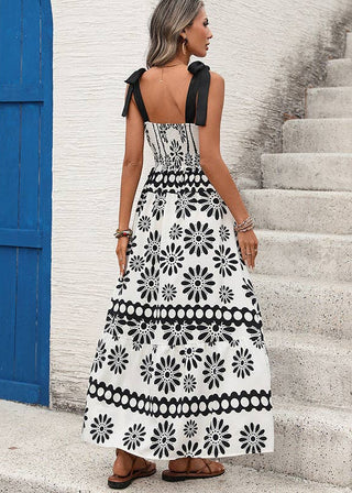 Sleeveless lightweight maxi dress with bold black boho floral print and flowy silhouette