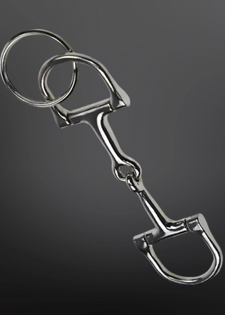Metal horse bridle bit on a dark background