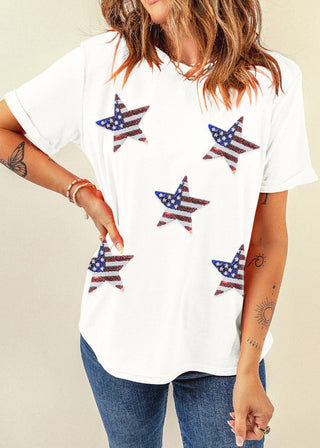 Model wearing white Americana sequin star tee with denim jeans
