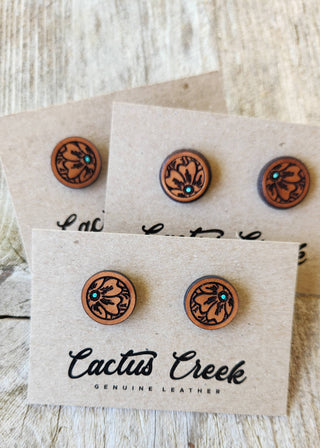 Wooden earrings on Cactus Creek branded display cards on a wooden surface