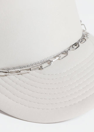 Silver chain necklace on a white trucker's hat
