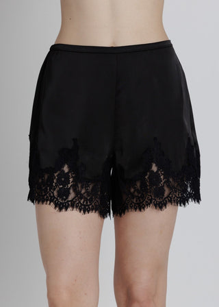 Black lace-trimmed shorts on a plain background