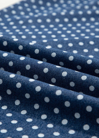 Close-up of blue fabric with white polka dots