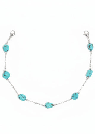 Trucker's hat chain with turquoise beads and silver chain on a white background