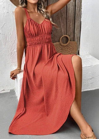 Woman wearing a red dress with a wooden background