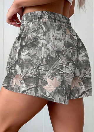 Floral patterned skirt worn by a person on a plain background