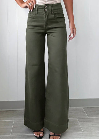 Person wearing olive green wide-leg pants with a white top against a light gray background
