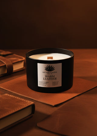 Warm leather soy candle with leather-bound books
