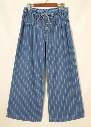 Blue striped pants on a beige background